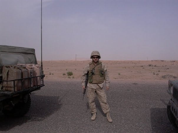 Robert in military uniform in a desert setting